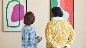 Two people looking at modern art