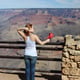 Woman standing on rock against mountain