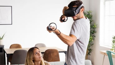 Close-up of a woman watching a man play