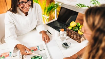 Nutritionist and Client Discussing Balanced Nutrition Plan