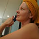 Young woman using infrared massager