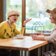 Senior women and cafe table