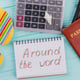Creative flat lay travel concept with passport, flip-flops and calculator. Around the world.