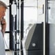 Patient with I.V drip on payphone