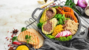 Vegan bowl quinoa avocado pumpkin with beans and corn in a black bowl Diet Top view Free space for text