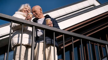 Low angle senior people with coffee cups