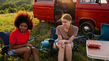 Medium shot women sitting on chairs