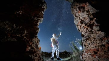 Man in special white space suit exploring stars