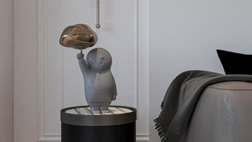 Closeup of a Modern Sculpture of a Figure Holding a Sphere