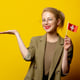 Style blonde woman in jacket with Swiss flag on yellow