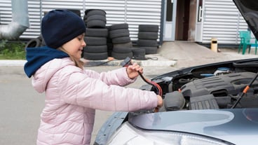 Children's auto mechanic changing wiring in a car Repair service