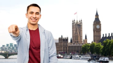 Man pointing finger to you over london background