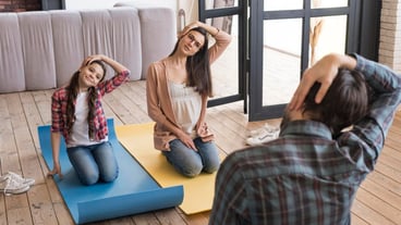 High angle family yoga sesion at home
