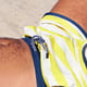Midsection of man lying on sand at beach