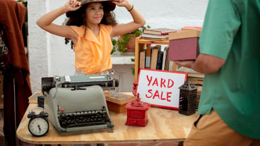 Side view man and girl at garage sale