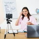 Young english teacher doing her class online