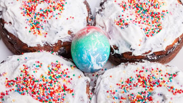 Easter holiday with colorful eggs and Easter cake on a plate while cooking Homemade cakes in the kitchen