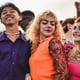 Group of young people dancing at music festival outdoor Diversity and friendship concept