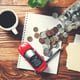 Coins in glass jar with car model