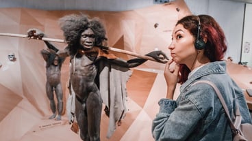 July 22, 2022 Neanderthal Museum Germany Detailed wax figure of prehistoric caveman Neanderthal with spear in the museum Human Sapiens anthropology science and theory of evolution
