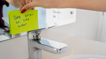 Young woman reminding to save water