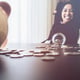 Beautiful young business girl saving money
