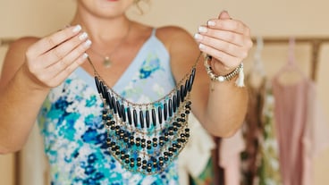 Woman demonstrating beautiful necklace