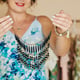 Woman demonstrating beautiful necklace
