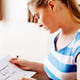 Close-up of young woman looking at paper