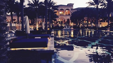 Swimming pool at illuminated resort