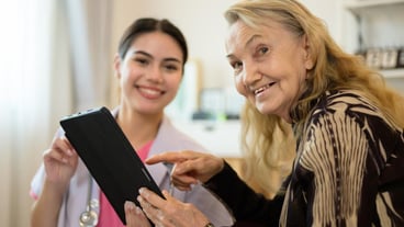 Professional doctor explaining prescription to senior patient at home visit People with health care service at home