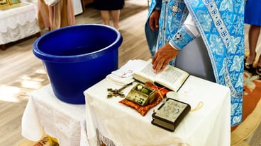 The sacrament of the rite baptism of a child in an Orthodox Christian church.