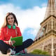 Technology, travel, tourism, music and people concept - smiling young woman or teenage girl with tablet pc computer and headphones over paris eiffel tower background