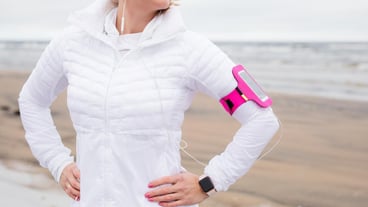 Woman standing before exercise on the beach in winter