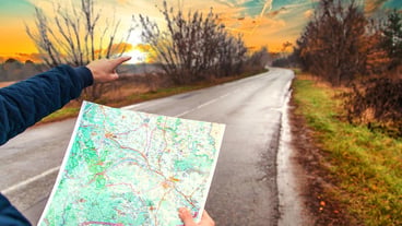 A man looks at a map on the road Selective focus