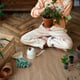 Person transplanting plants in new pots