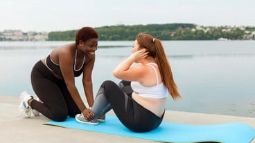 Female friends exercising outdoors