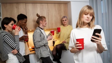 Medium shot woman holding smartphone