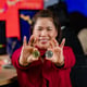 Closeup shot of golden bitcoin electronic token cryptocurrency money in businesswoman investor
