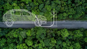 Electric vehicle car going through forest EV electrical energy for environment Nature power technology sustainable devlopment goals green energy Ecosystem ecology healthy environment road trip