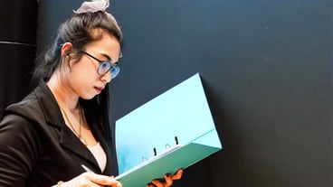 Asian woman  intentionally checking the document