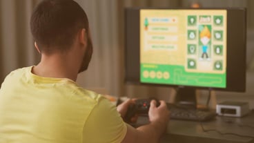 Young man playing video games at home