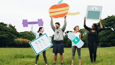 Happy diverse people working out in the park