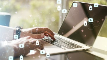 Creative concept of abstract medical illustration and hands typing on a laptop in the background. Medical and health concept. Multiple exposure.