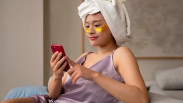 Side view woman using eye patches