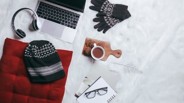 Creative flat lay compositionof winter gloves beanie and work accessories for winter background