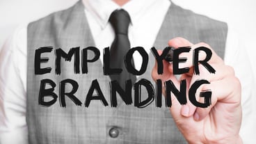 Businessman writing word Employer Branding with marker