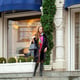 Young beautiful woman in stylish mink coat on a background of a winter street