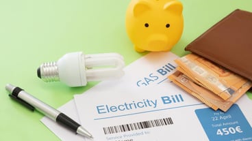 Electricity bill euro banknote light bulb and piggy bank Savings on household costs