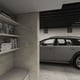 a silver car is parked in a room with a shelf full of books and a shelf with a shelf above it